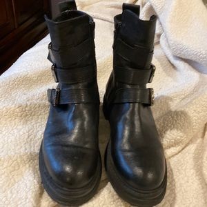 Black three buckle booties.